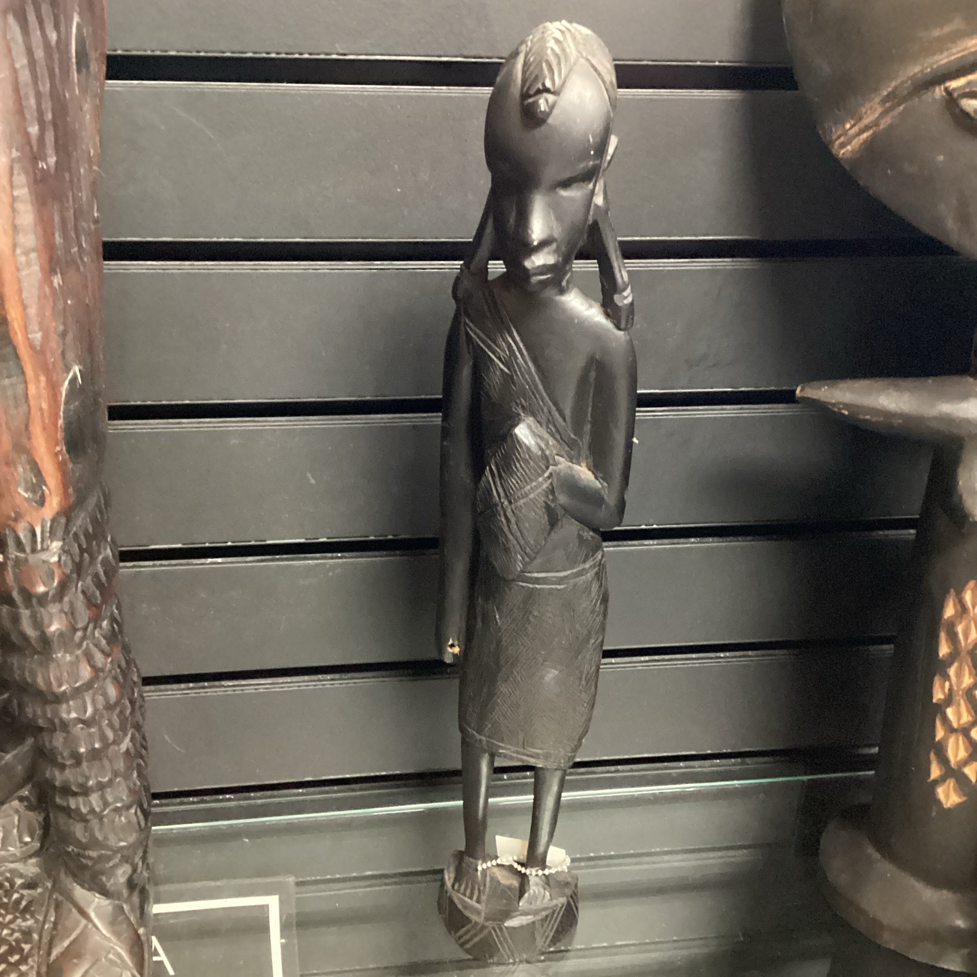 Hand Carved “Village Warrior Woman Holding Shield” Statue (shelf 9)
