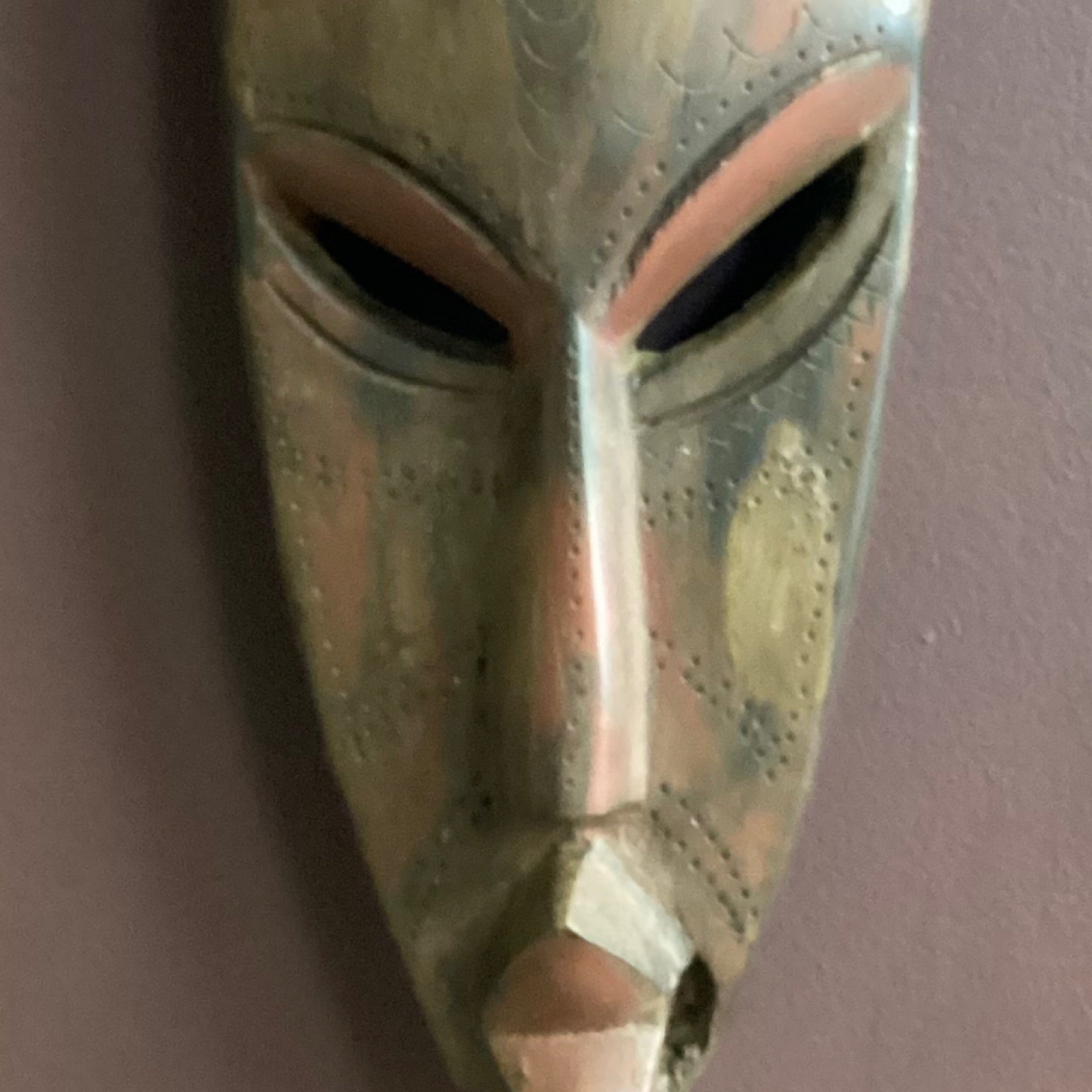 Hand carved bald head African mask (right hallway wall)