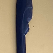 Elongated village wall figure