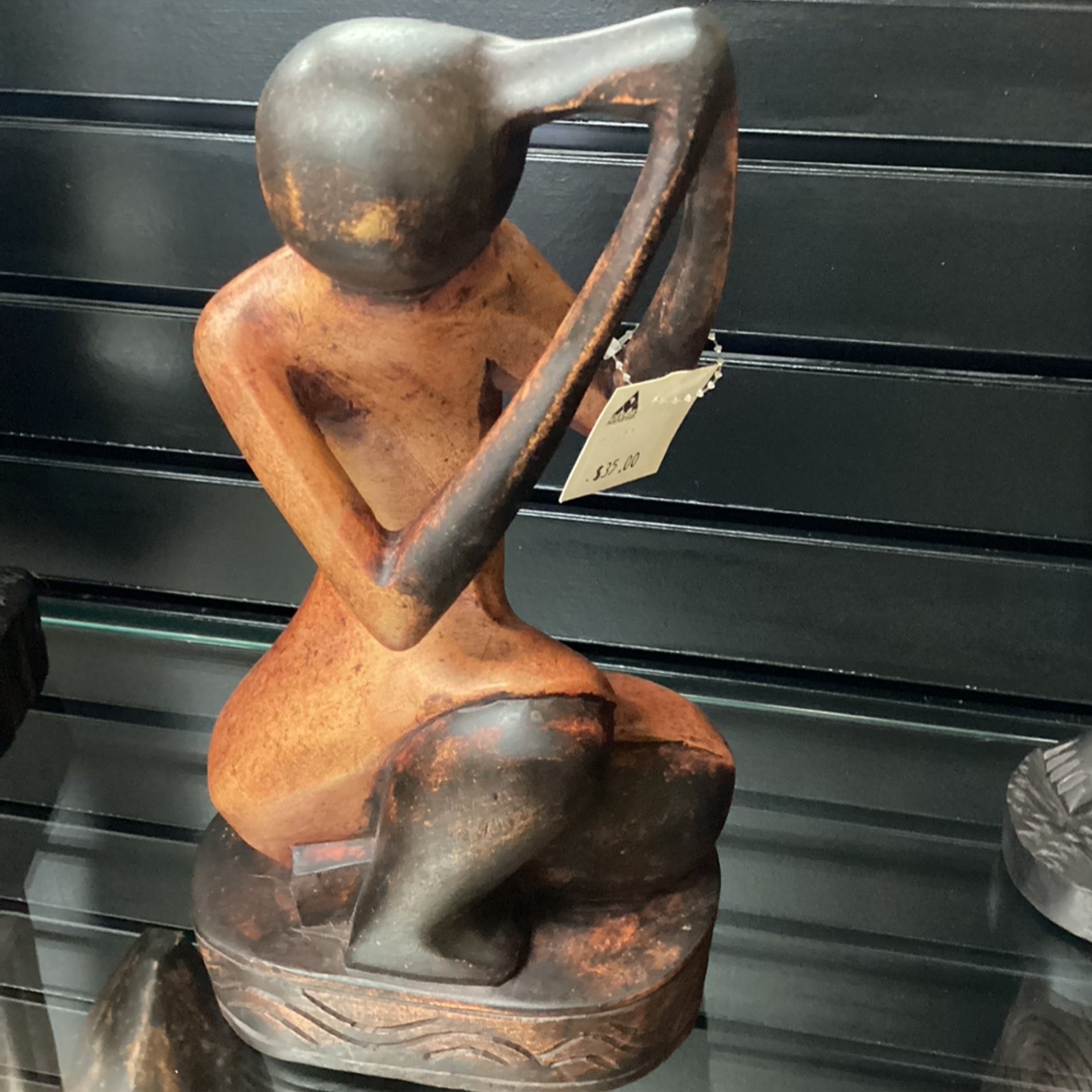 Hand Carved Sitting Woman Braiding Hair (Shelf 3)